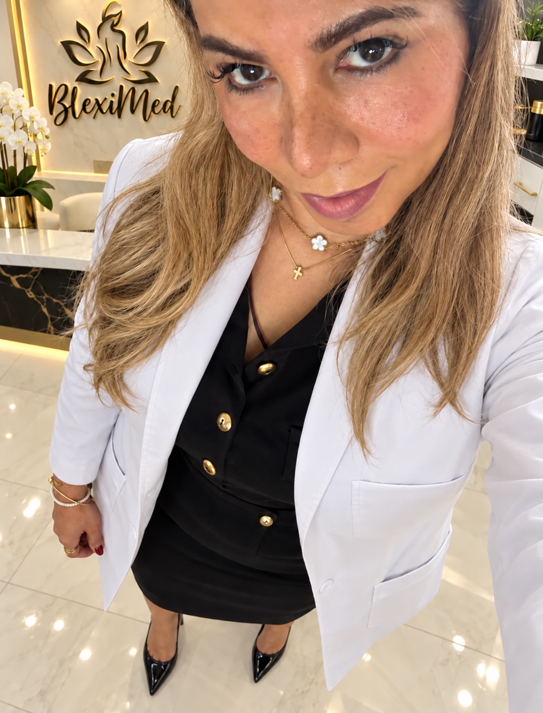 Bleixin Carvajal in a white lab coat at BlexiMed Clinic